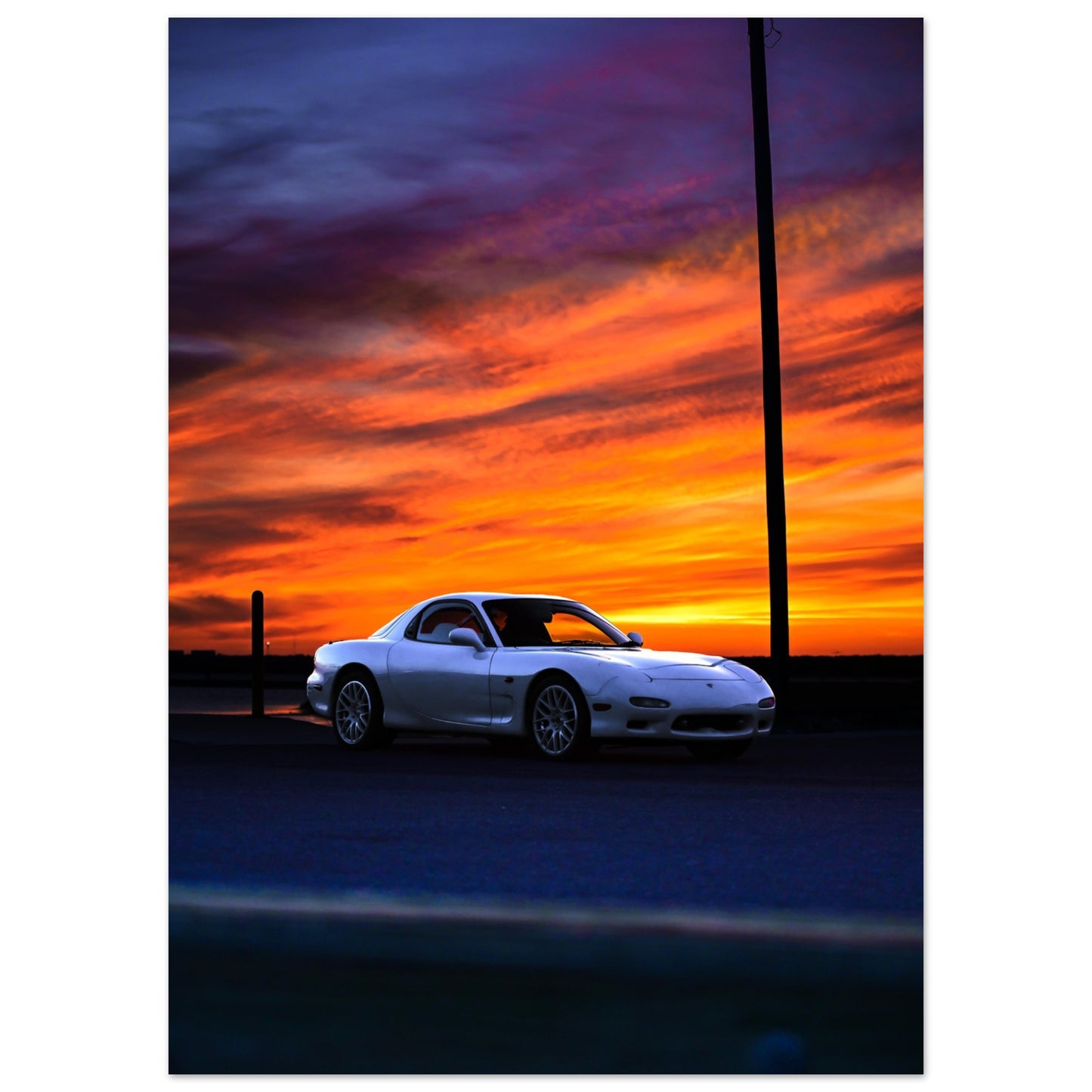 Sundown Elegance: Mazda RX7 Silhouetted in the Sunset
